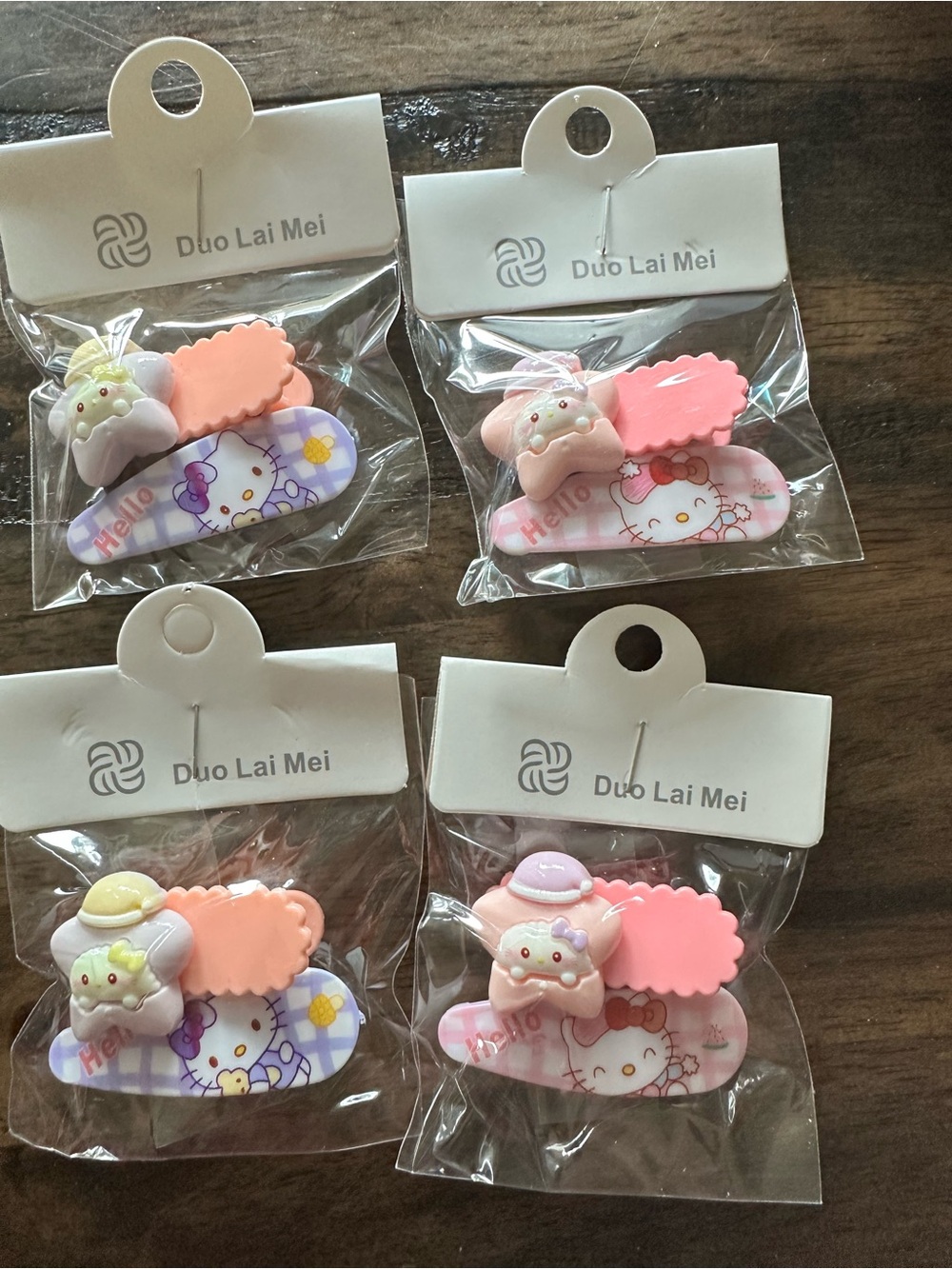 NWT Set of 4 Hello Kitty Child Size Hair Clips Barretts Pink Purple & Orange